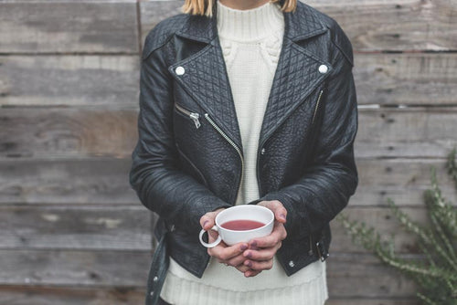 woman wearing classic biker-style leather jacket